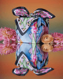 Sephora and Wrappr collobaration photo of a  gift box wrapped in furoshiki surrounded by flowers 